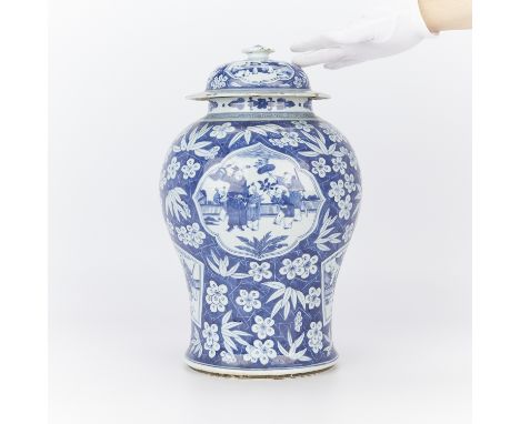 Late 18th to early 19th century Chinese blue and white porcelain baluster vase. Decorated with floral motifs interspersed wit