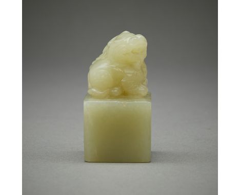 One 20th c. Chinese carved jade seal or chop surmounted by a mythological beast.Height: 2 in x width: 1 1/8 in x depth: 1 1/8