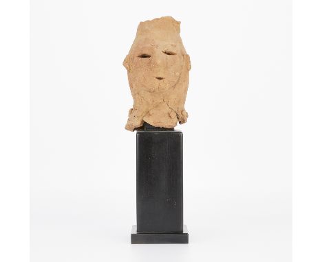 Japanese earthenware Haniwa head, Kofun period, 5th to 6th century. Of low-fired reddish clay possibly modeled as a shamaness