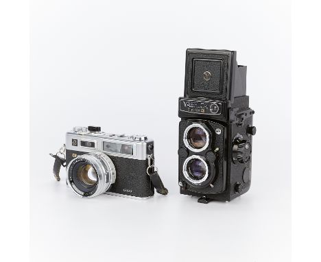 Group of two Japanese Yashica cameras including:One Yashica Mat 124G TLR medium format camera with two 80 mm lenses: one 2.8 