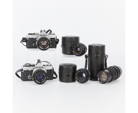 Group of five Olympus cameras and lenses including:One Olympus OM-1N 35mm camera. Body with serial number 1846531. With a 50m