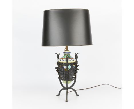 Italian ceramic pottery lamp fitted with an iron stand. The pottery glazed with floral motifs and scrollwork. The iron stand 