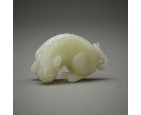 One 20th c. Chinese jade carving in the form of a tiger.Height: 1 in x width: 1 3/4 in x depth: 3/4 in. Weight: 17.88 grams.C