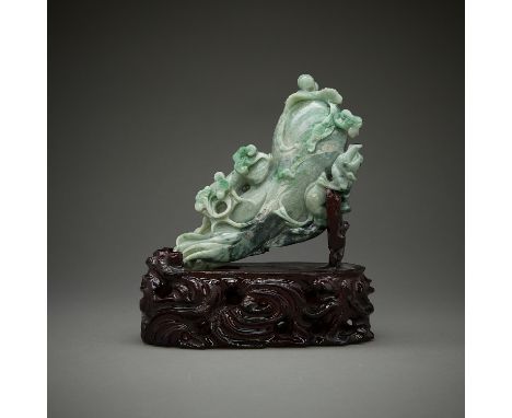 Chinese carved jade melon with a ruyi scepter and lingzhi mushrooms. With a carved wooden stand.Height: 4 3/4 in x width: 7 i
