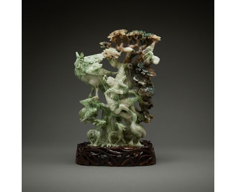 Chinese Henan Dushan jade carving in the form of a pine tree crowded by a phoenix, cranes, and deer. With a carved wooden sta