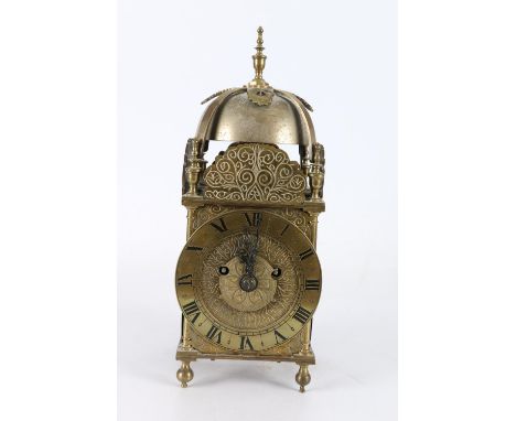 Antique brass lantern clock of good proportions, the dial with Roman numeral chapter ring, striking on a bell, 40cm tall 