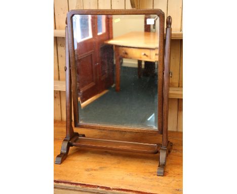 Whytock and Reid shaped swing dressing glass with shelf below, 70 cm tall.