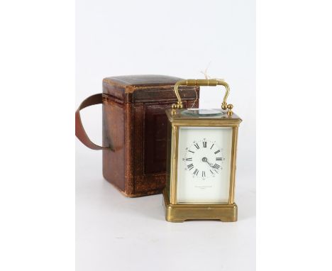 French carriage clock by Mackay and Chisholm, the white enamel dial with Roman numeral chapters, lever escapement, in leather