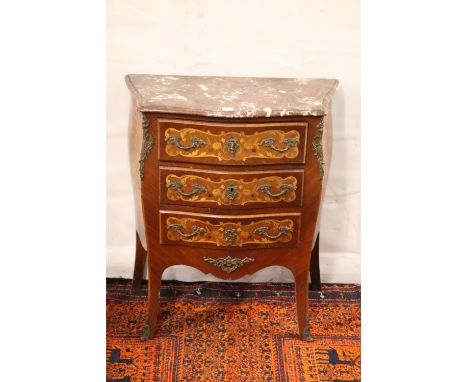 French kingswood and satinwood marquetry inlaid marble topped bombe commode chest having three drawers embellished with ormol