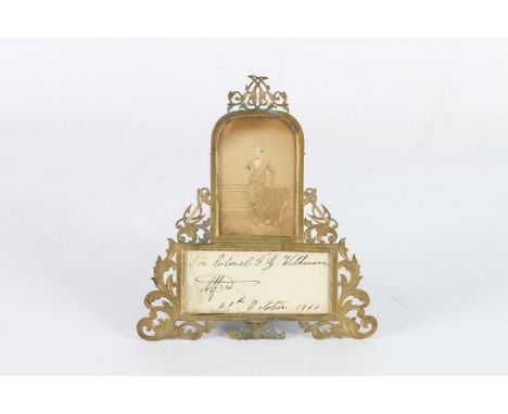 19th century photograph of a boy wearing three piece suit within a Rococo style gilt metal easel frame with fouled anchors, p