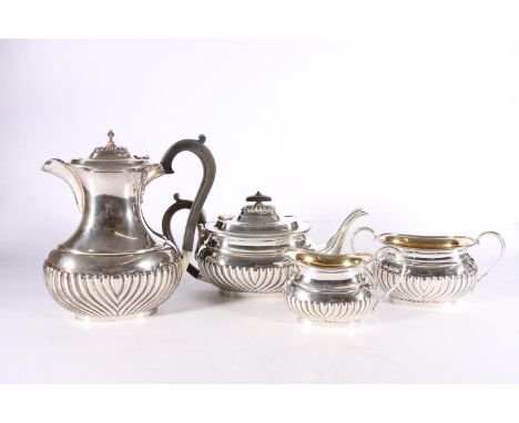 Victorian silver four-piece tea set with gadrooned bottom half and gilded interior by Samuel Walton Smith, London 1895 and 18