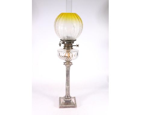 Silver plated Corinthian column paraffin lamp by HE&Co (Hawksworth, Eyre & Co), with glass reservoir, chimney and etched yell