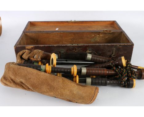 Old set of bagpipes, the chanter marked for P Henderson of Glasgow, in hinge topped wooden box, 58cm wide Mouthpiece appears 