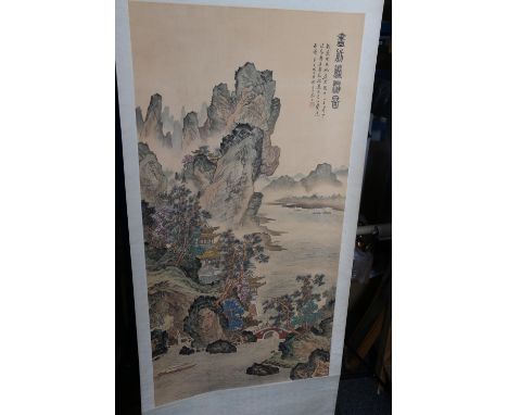 20th century Chinese scroll depicting a boat passing a palace in a mountain setting with figures on a bridge, signed and with