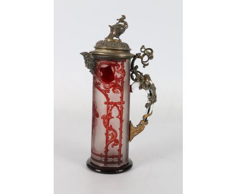 Bohemian ruby flash glass metal mounted ewer, the body depicting a Knight standing resting upon shield within an arbour, the 