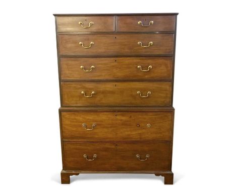 A George III mahogany chest on chest, the top section with two short over three long drawers, the base section with two deep 