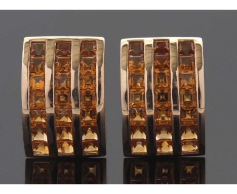 A pair of citrine earrings, the curved rectangular earrings set with three rows of square step cut citrines, with clip and po