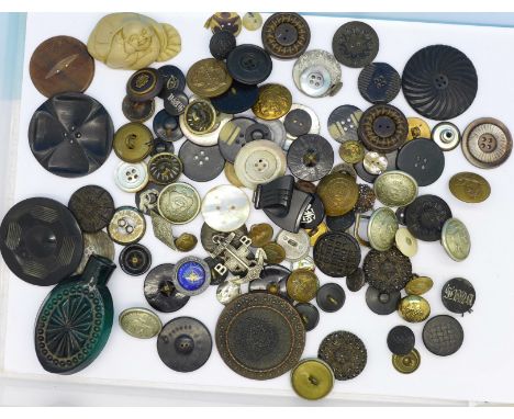 A collection of buttons including uniform and mother of pearl, and a modern netsuke