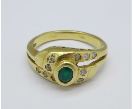 An 18ct gold, green and white stone ring, 4.5g, K