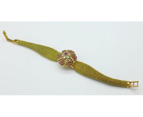 A lady's 1960's 18ct gold Omega wristwatch with ruby and diamond set flip over cover, 47.7g