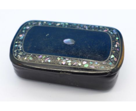 A papier mache and mother of pearl snuff box