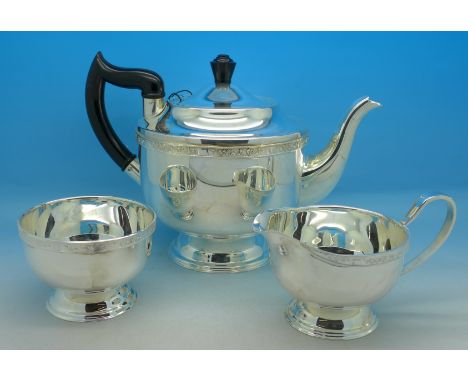 A three piece plated Viners tea service, (as new), with boxes