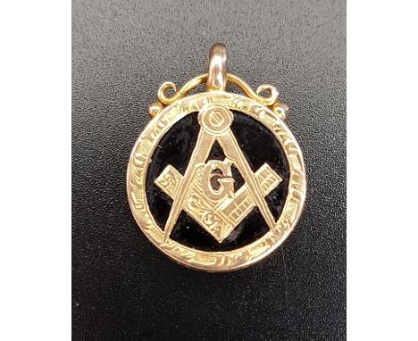 MASONIC FIFTEEN CARAT GOLD AND BLACK AGATE FOBthe circular black agate with applied fifteen carat gold decoration including c