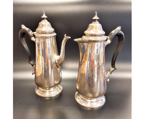 GEORGE V SILVER TEA POT AND COMPANION HOT WATER JUGboth of baluster form with scroll shaped ebonised handles and bearing insc