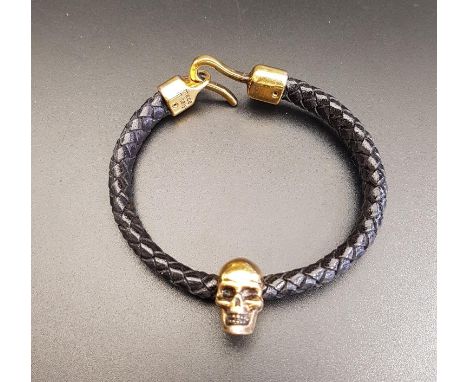 ALEXANDER McQUEEN SKULL LEATHER BRACELETthe brass skull on a plaited leather bracelet, with hook closure 