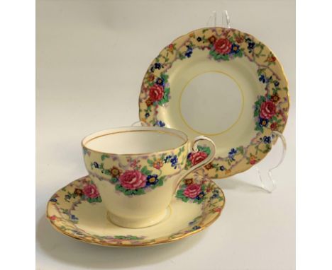 AYNSLEY  TEA SERVICEthe white and pale yellow ground decorated with roses and other flowers with gilt highlights, comprising 