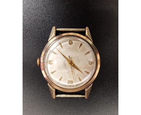 LATE 1950s TUDOR ROYAL GENTLEMEN'S NINE CARAT GOLD CASED WRISTWATCHthe dial with Arabic 3, 6, 9 and 12 and arrow five minute 
