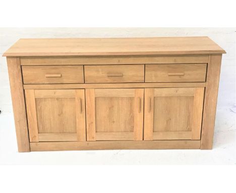 LARGE LIGHT OAK SIDE CABINETwith a moulded top above three frieze drawers with three panelled cupboard doors below, standing 