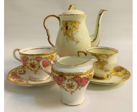 ROYAL STAFFORD COFFEE SERVICEthe white ground decorated with yellow leaves with gilt highlights, comprising coffee pot, coffe