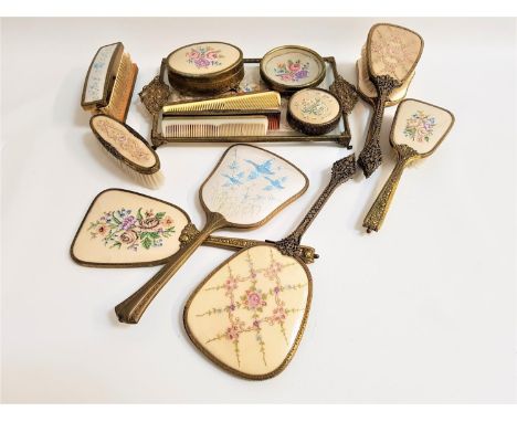 SELECTION OF LADIES DRESSING TABLE SETScomprising three hand mirrors, six brushes, three combs, trinket box, concave dish and