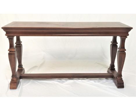 OAK CONSOLE TABLEwith a rectangular quarter veneered top, standing on four turned and tapering supports united by a stretcher