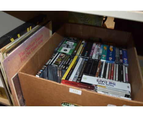A box full of compact discs and DVDs and a small amount of LPs, something for everyone!