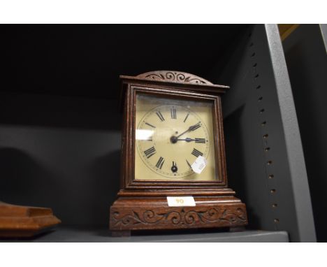 A small bracket clock having and oak case and movement marked W&amp;H Sch