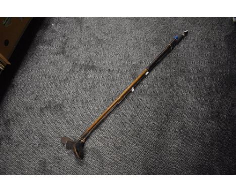 Three vintage golf clubs two being hickory shafted chippers and a similar club
