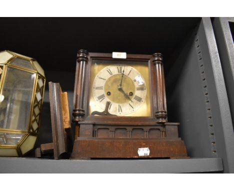 A late Victorian bracket clock having brass face dial and stained case as found