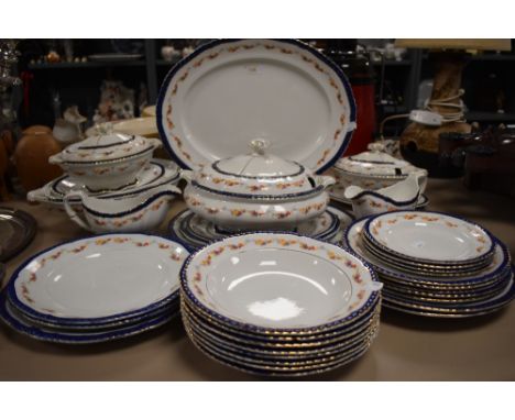 A part tea and dinner service having cobalt and gilt glaze with tureens and soup bowls etc