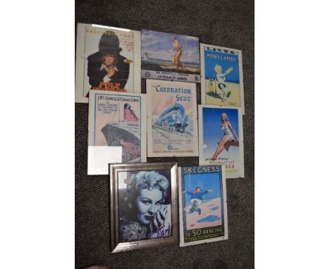 A selection of vintage style prints in frames.
