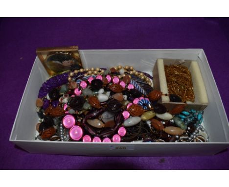 A box of costume jewellery necklaces of various forms and a powder compact