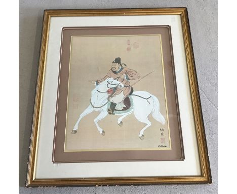 A large signed Japanese print of a horseman. Gilt framed and glazed. Approx. 92cm x 78cm.