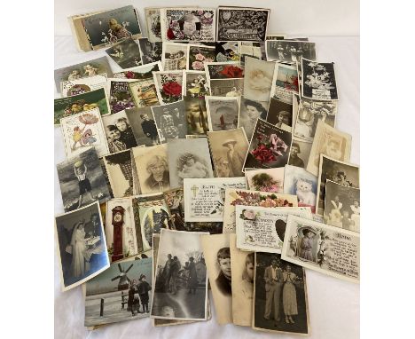 A quantity of 120+ vintage and Victorian postcards and photographs. Mostly Christmas, Birthday, Easter and greetings cards. 
