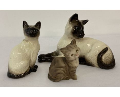 3 Beswick ceramic cat figurines. Comprising: Siamese cat laying #1558, Siamese cat sitting #1887 (both in gloss finish) and k