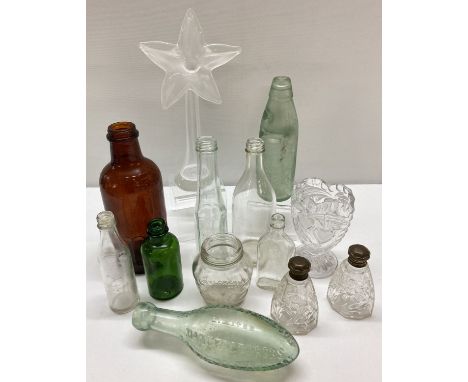 A collection of vintage glassware to include advertising bottles. Lot includes: Brylcream jar, Alma Woods codd bottle, Stewar