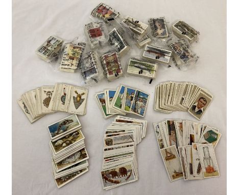 A quantity of vintage cigarette cards from Wills, Park Drive, Gallaher, Churchman &amp; John Player. To include: Army Badges,