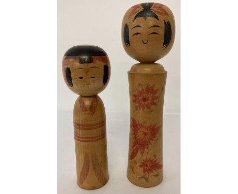2 vintage wooden Japanese Kakashi dolls, both with signatures to underside.  Largest approx. 28cm tall.