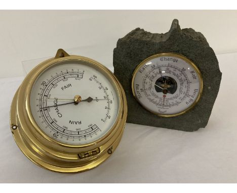 A brass cased ships barometer together with a freestanding "Daymaster" barometer set in slate.  
