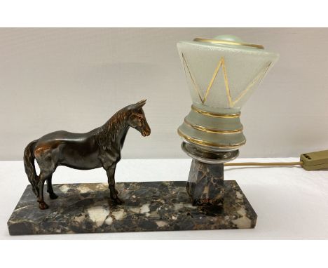 An Art Deco marble based bedside light with spelter horse figurine and period glass shade. Has been rewired and in working or